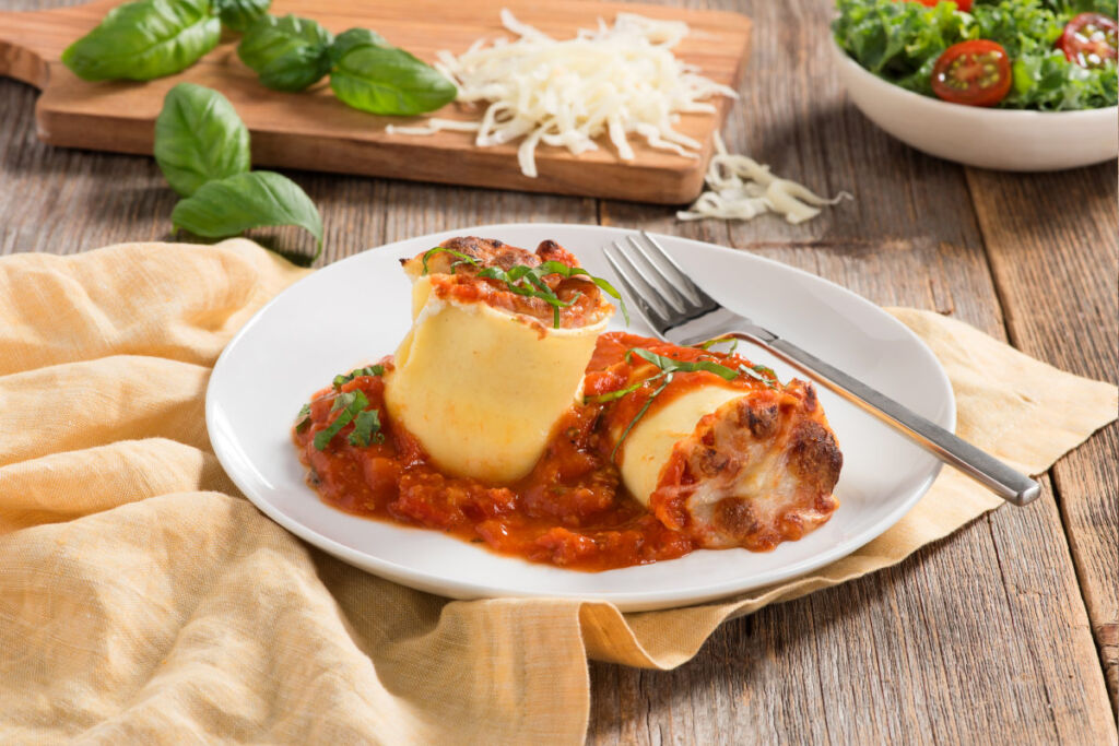 lasagna-roll-ups-with-sausage-sauce-on-plate